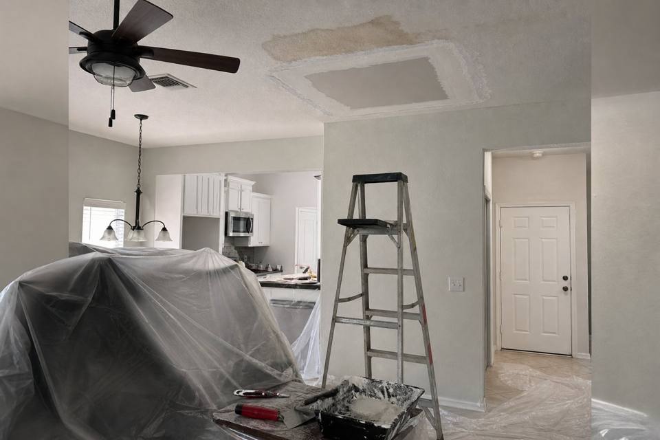 Ceiling drywall repair setup below a water stain for Vero Beach drywall projects